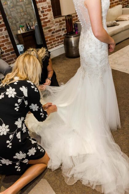 Getting Dress Fixed In The Bridal Suite Cam North Photography
